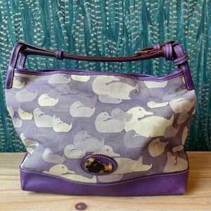 Purple Dooney & Bourke canvas and leather duck printed shoulder bag.